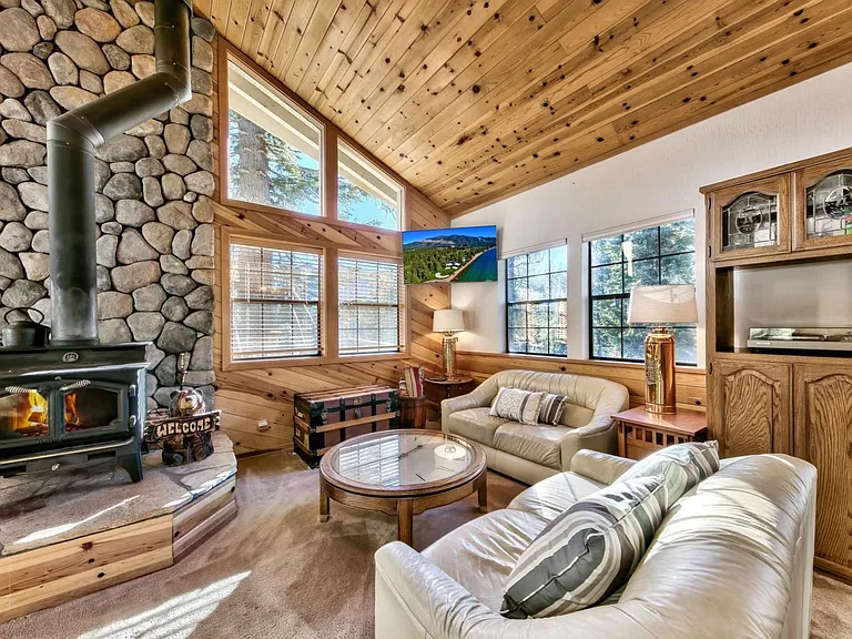 Living room with the wood burning stove and amazing views.