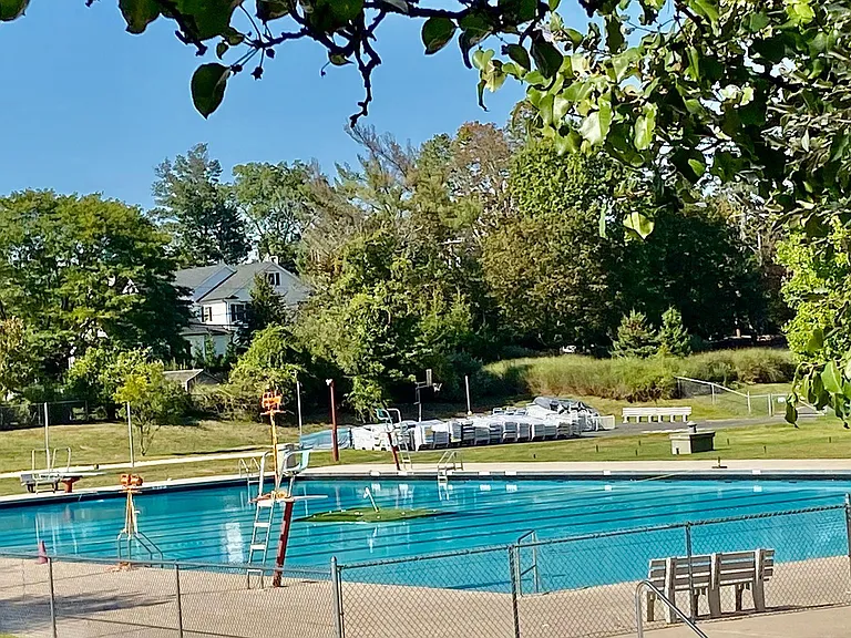 Multiple outdoor pools for the young and adult crowd that serve drinks and food.