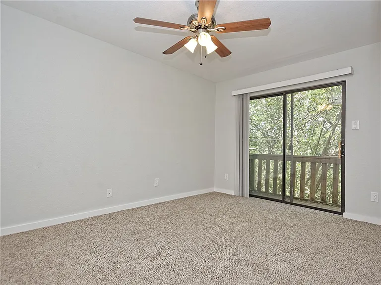 Bedroom 1 with connecting balcony overlooking Greenbelt!