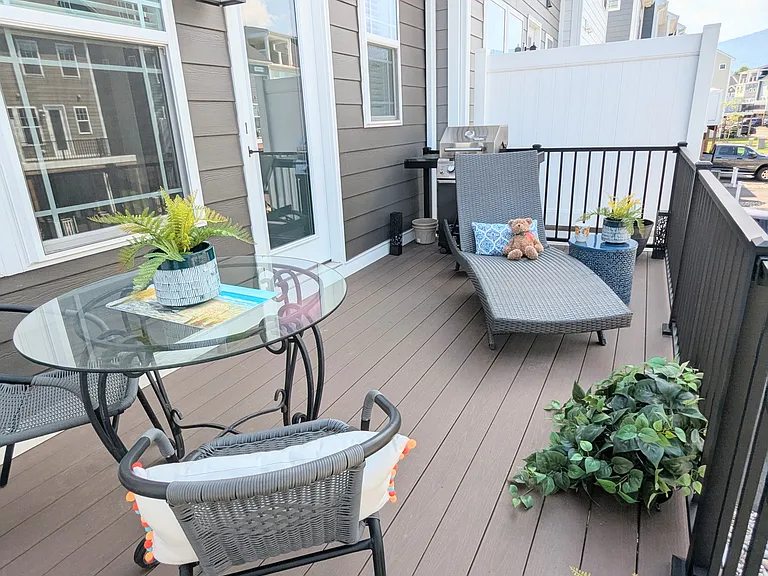 Trex deck, elevated. Patio furniture included.