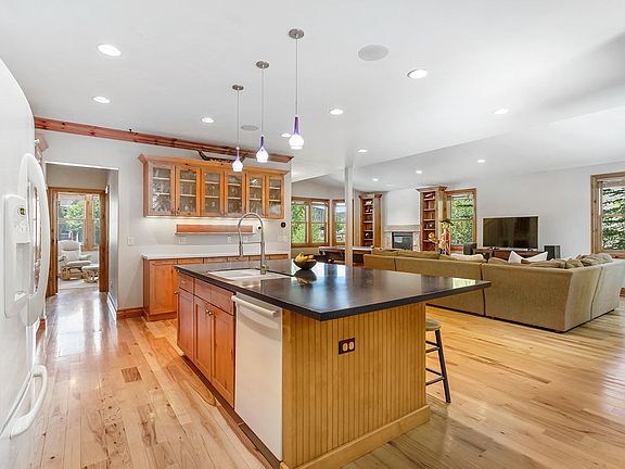 Main floor living areas and secondary bedroom feature hickory hardwoods throughout