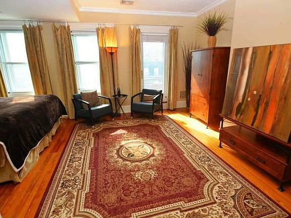 3rd floor Room C sitting area. Artwork is replaced by a 50-inch tv. Wardrobe has been replaced.