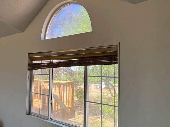 Vaulted living room, new floors, fresh paint. New blinds being installed.