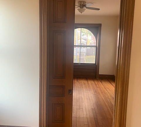 Dining room/middle room looking toward front room. Pocket door is functional and allows you to close off front room for a bedroom, office, etc.