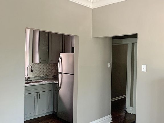 Dining area looking into kitchen and hallway