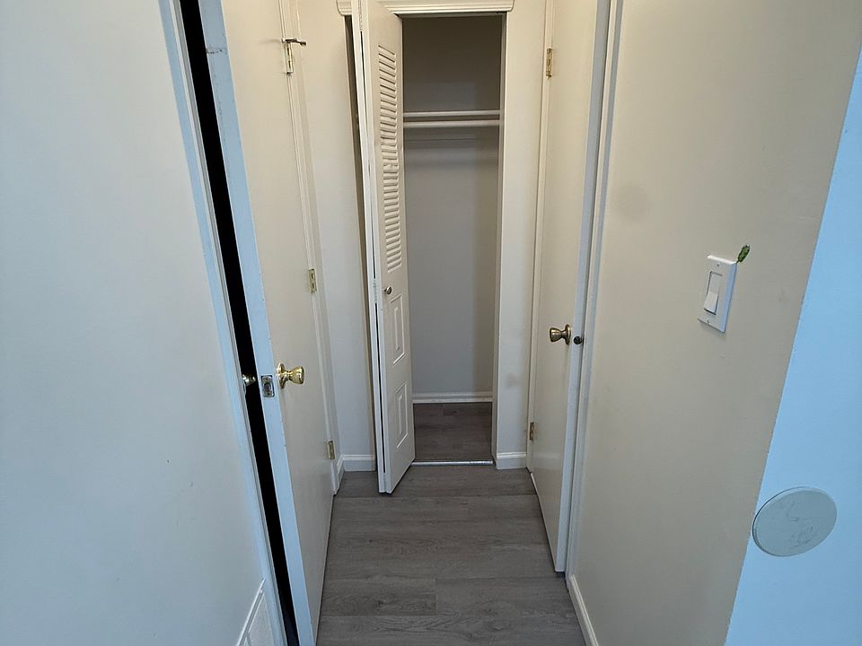 Laundry on left bathroom on the right and closet space in front. Next to front door.