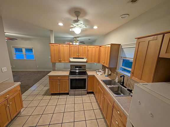 Kitchen View and entrance to Living Room area from Bathroom entrance