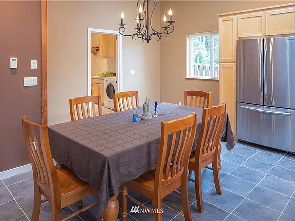 Dining area large enough for even a bigger table. Thru door to mud room that has WD, utility sink and seating area to take your shoes off when entering from outside or the garage.