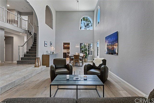 Architectural features such as high ceilings and a variety of arched and standard windows are designed to create a voluminous li