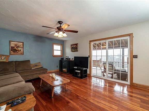 LIVING ROOM OPENING TO 28X9  ELEVATED COVERED PORCH.