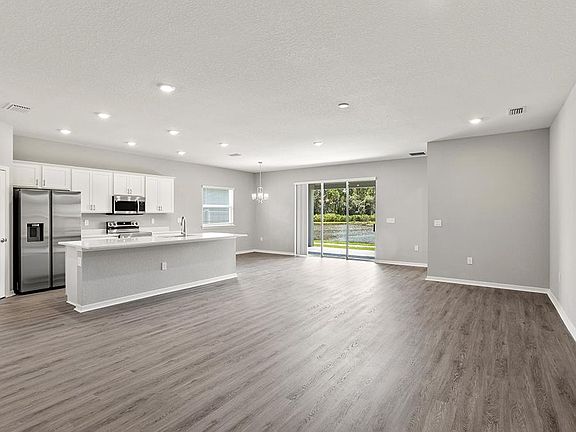 Enjoy a light-filled, open-concept living area - Aubrey by Highland Homes