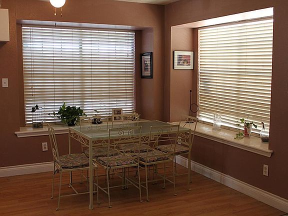Large breakfast area with  large windows for natural light, and window seats.