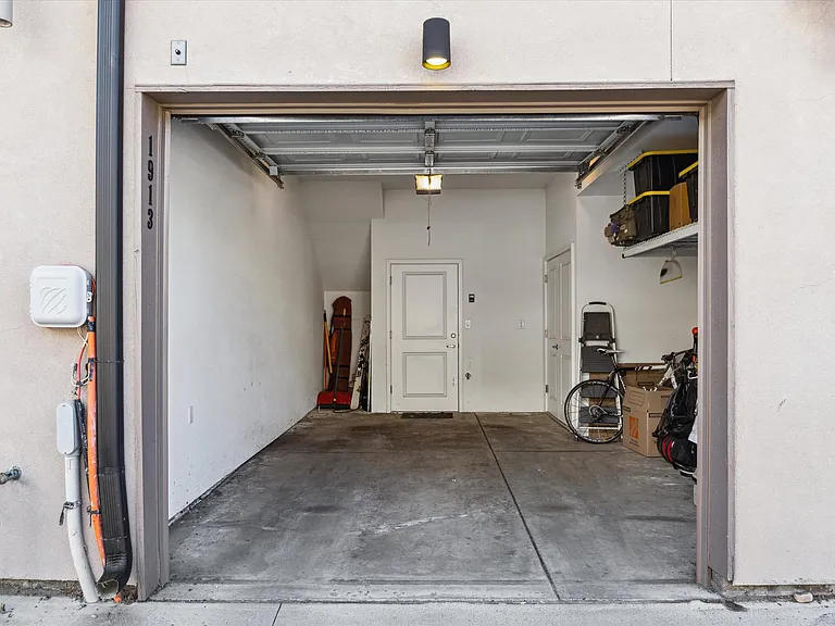 Oversized one car garage with plenty of parking in front of home as well