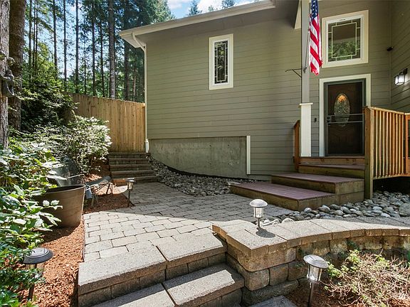 Lovely paver path leads to the front door. >