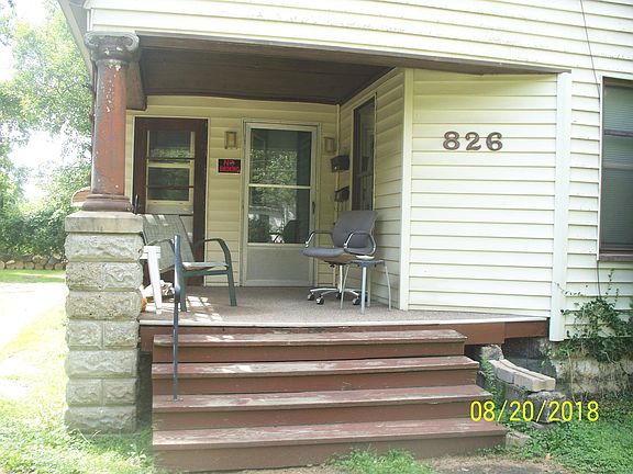 Front porch, entrance on right.