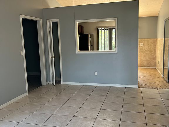 Living room with ceiling fan.