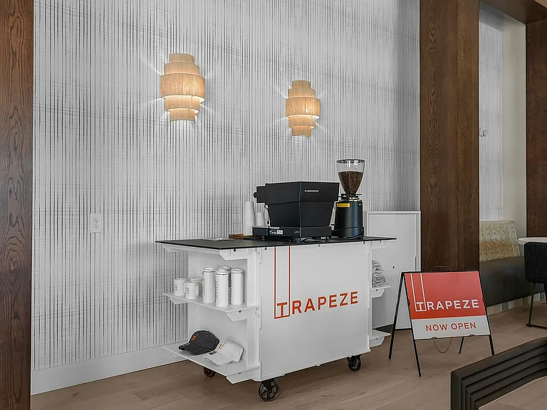 Experience cozy elegance at the Trapeze coffee corner, now open for your relaxation.