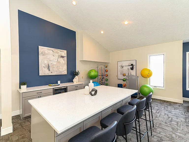 Experience wellness in style with this contemporary fitness lounge.