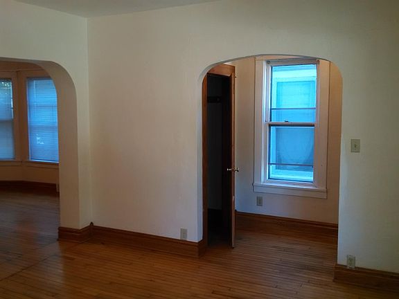 living room view toward front hall & closet & DR view