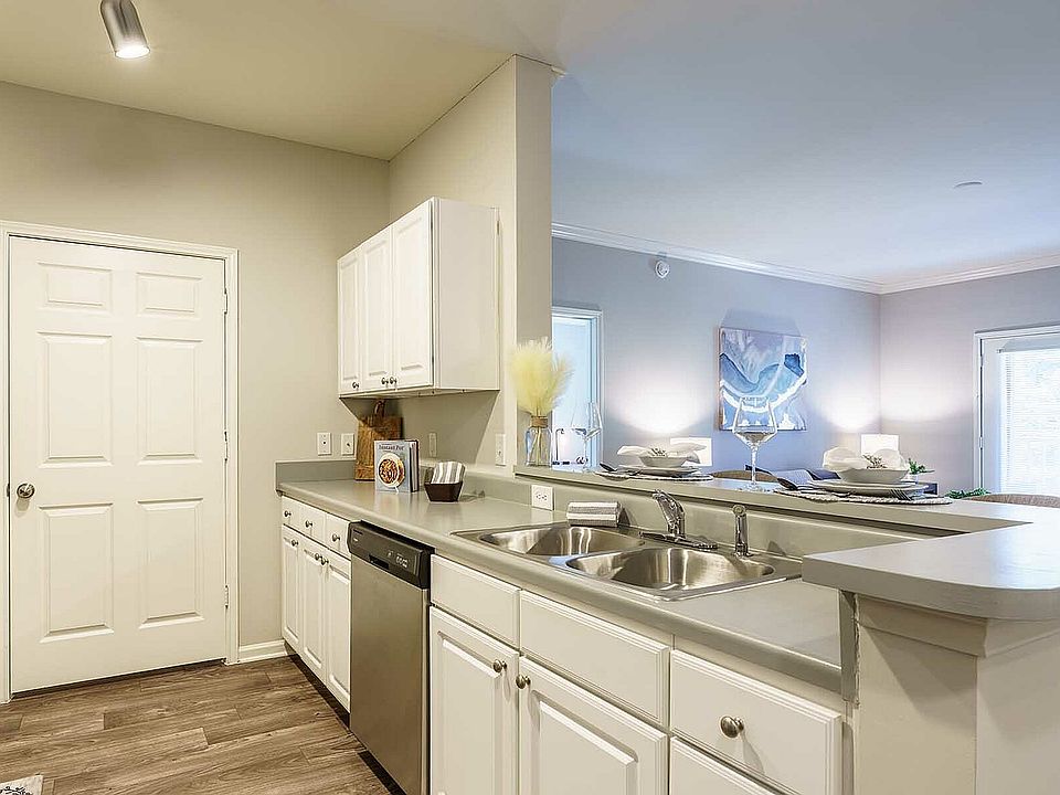 Experience the seamless blend of a modern kitchen and cozy living space.