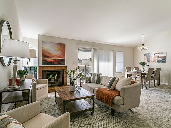 Living room opens to grassy area.