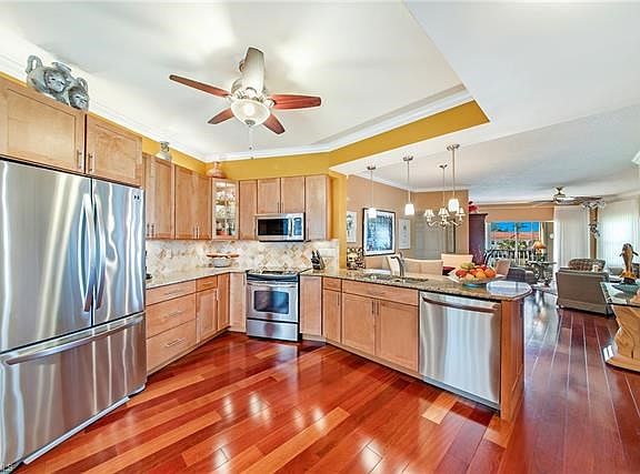 View from front door through kitchen and dinning, toward living area.