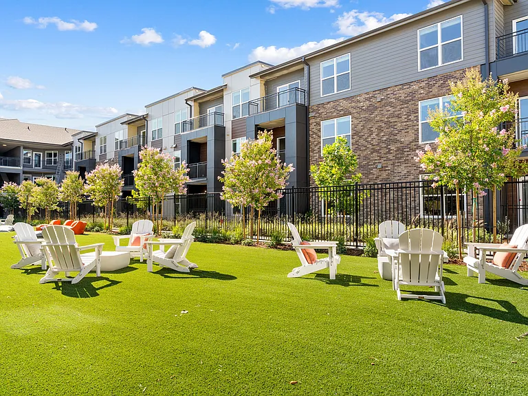 Relax and socialize with friends and neighbors in the green courtyard