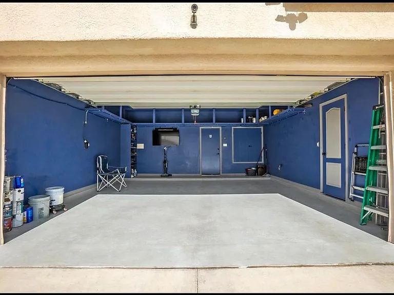 2 car garage with storage room