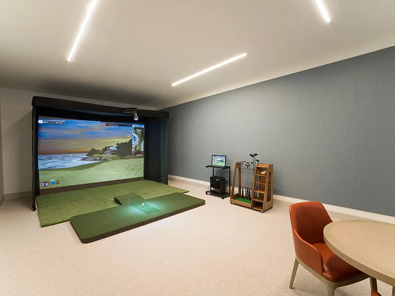 Practice your swing year-round in the on-site golf simulator at Modera Liberty Row, offering a convenient way to play and refine your game close to home.