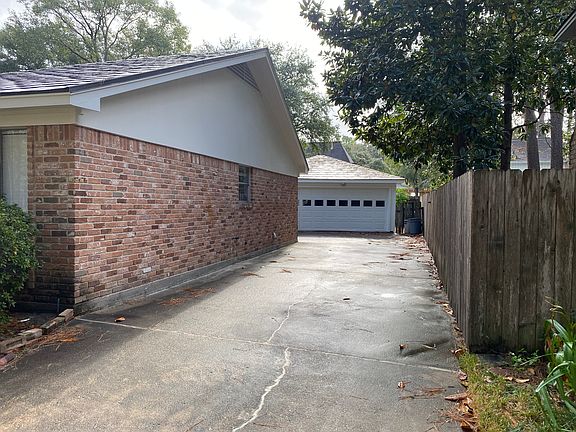 Looking up the driveway at the 2 car garage