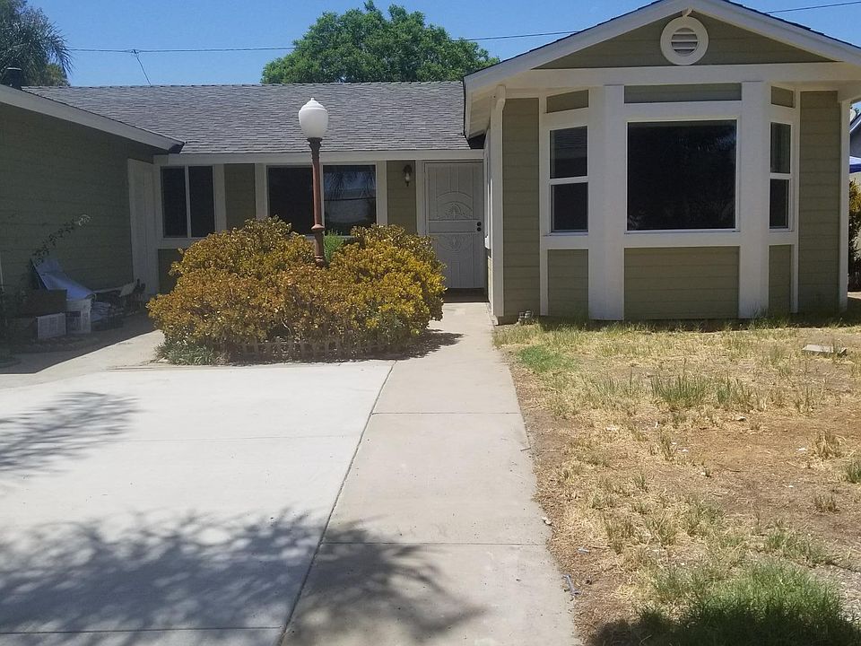 Lovely home with plenty of shades in front yard. Front door 