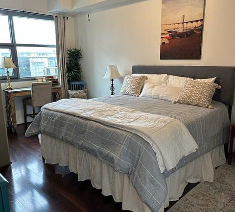 large one bedroom with king size bed, walk in closet, work space with a view