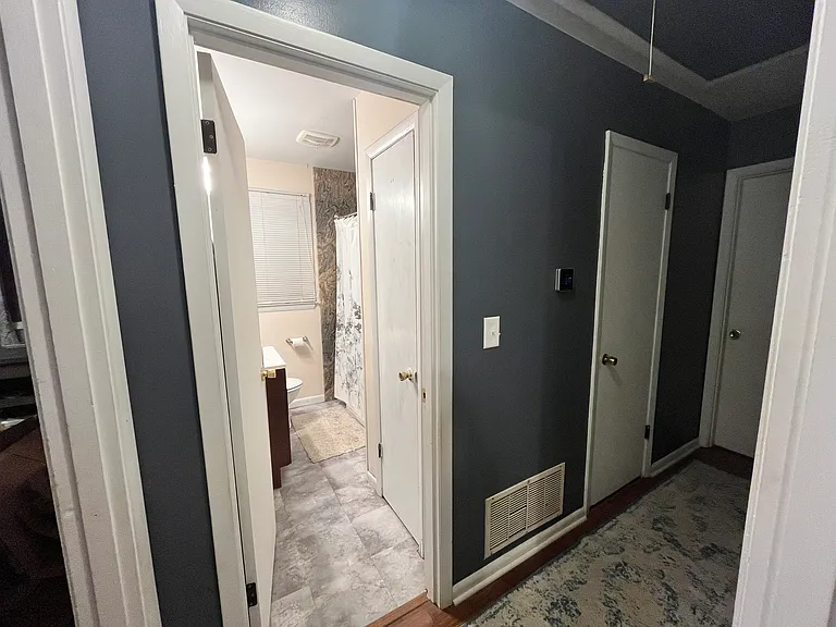 Hallway looking into the full bathroom