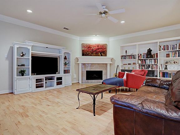The living room will be your center of entertainment and are adorned with crown molding, gas fireplace, and wood floors.