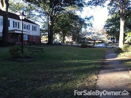 COURTYARD VIEW : TWO ENTRANCES ONE FACING COURTYARD OTHER FACING PARKING AREA