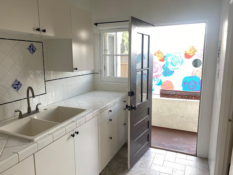 Full Kitchen, Tile counters and floors, includes fridge and stove