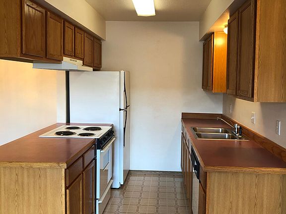 Kitchen with electric range, dishwasher and refrigerator/freezer