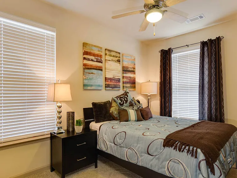 Cozy bedrooms with large windows for plenty of natural lighting
