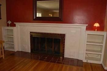 Bookshelves and white mantel are beautiful.