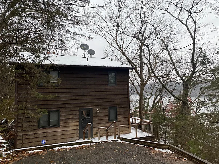 Entry/north side of house and parking pad
