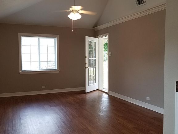Living Room includes hardwood floors and vaulted ceilings