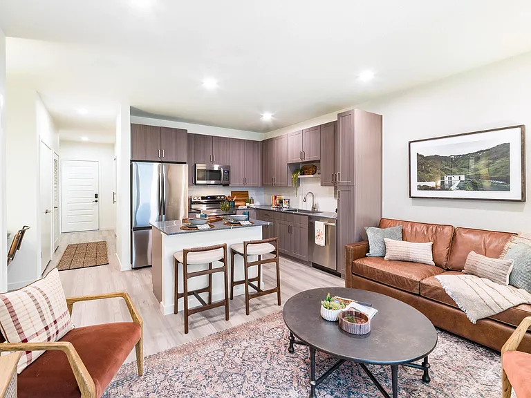 An open-concept apartment home at Modera University Park, where kitchen, dining, and living spaces come together for effortless everyday living.