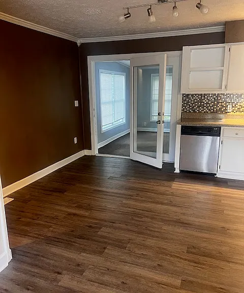 Open kitchen, showing double doors into family room