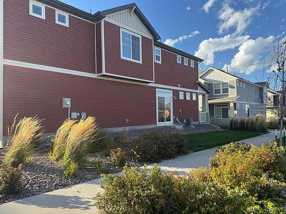 Side yard and sliding glass door entry at 9278 Turlough