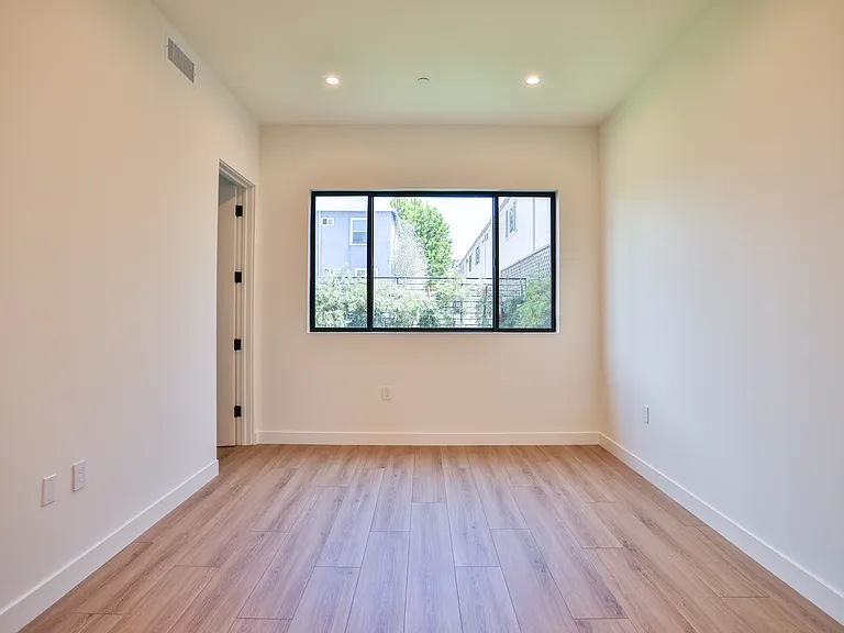 Bedroom with view to private yard
