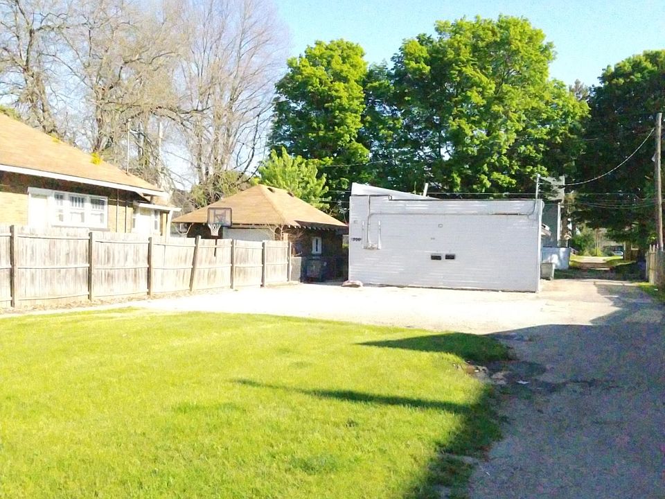 Front of building with gravel driveway