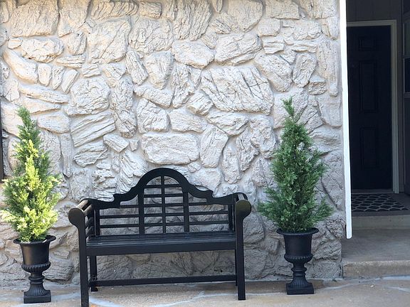 Front of house where a nice bench and plants can be added