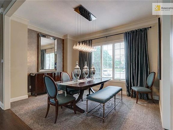 Formal dining room has plenty of space for hosting lots of guest.