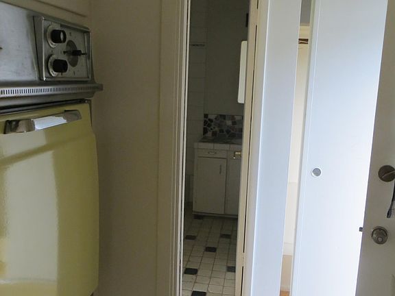 Photo taken from kitchen area of entry way and bathroom