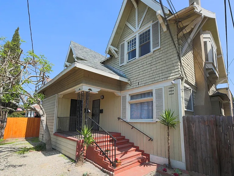 Front of house, classic Victorian early 20th century style seen in historic West Adams' neighborhoods.